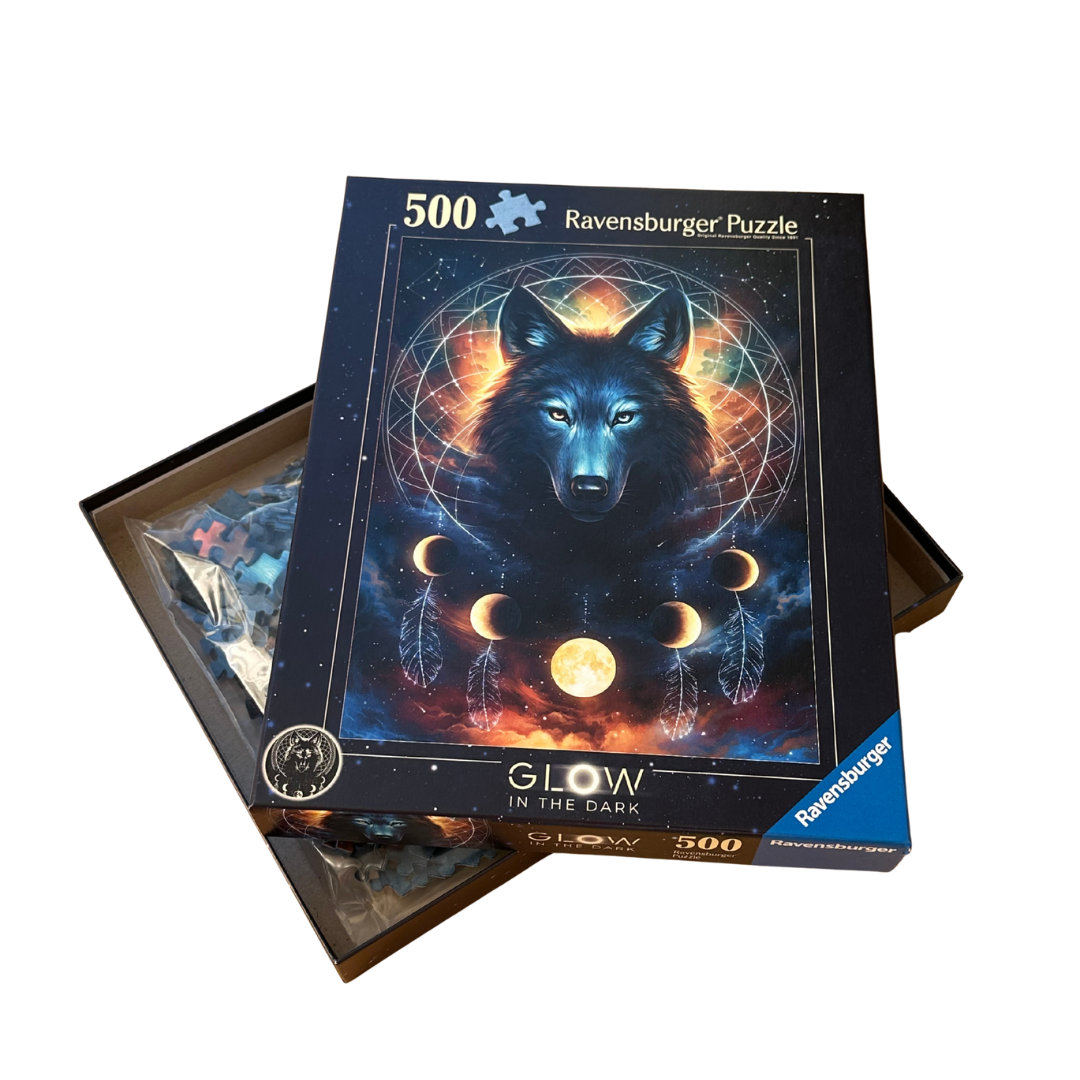Ravensburger 500-piece puzzle box with wolf design and 'Glow in the Dark' text on a white background