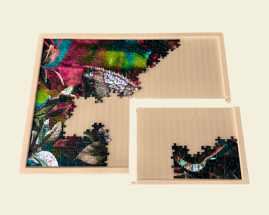A half-completed puzzle on a modular 3D-printed puzzle board.