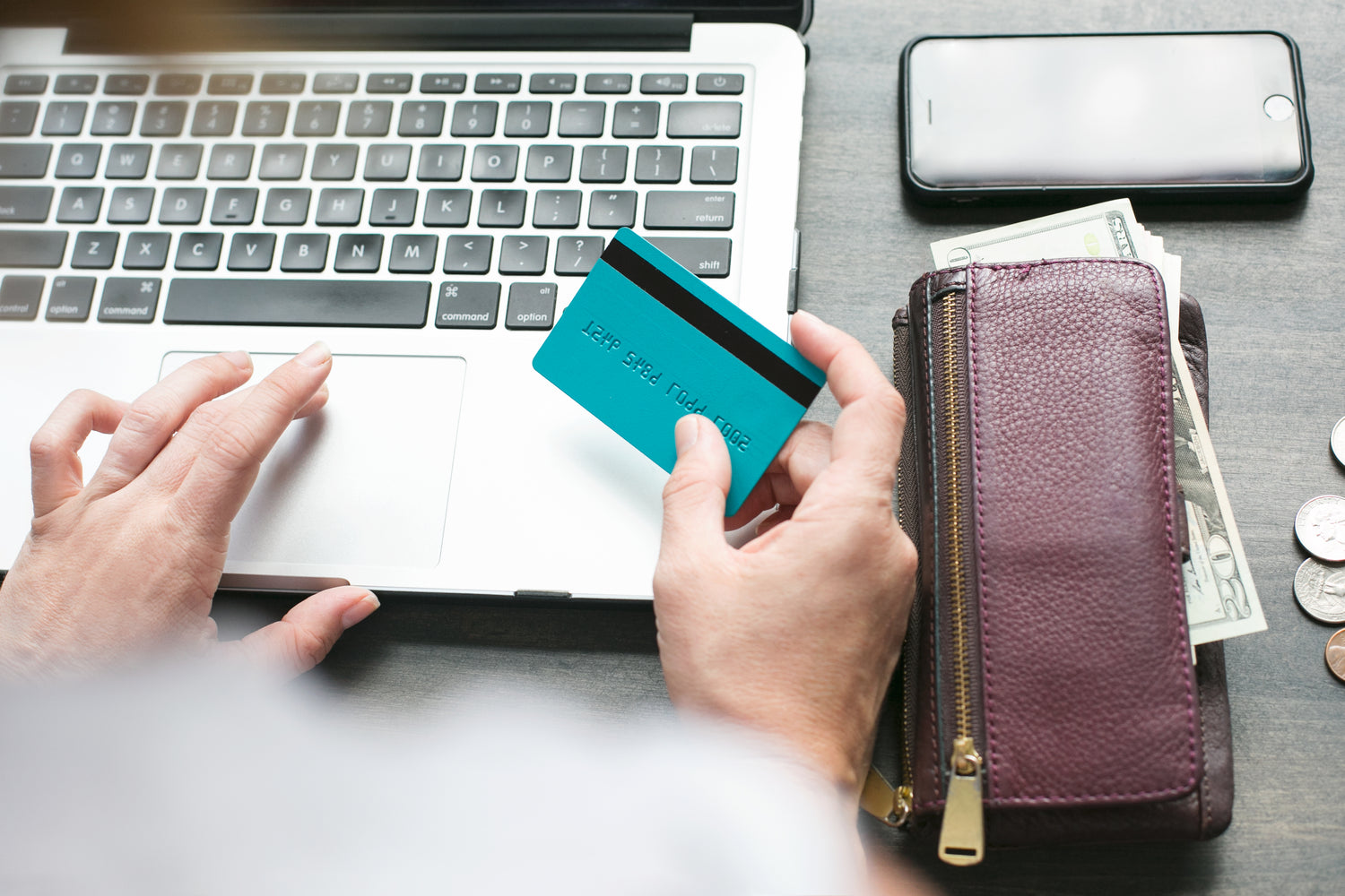 Person buying online with a credit card.